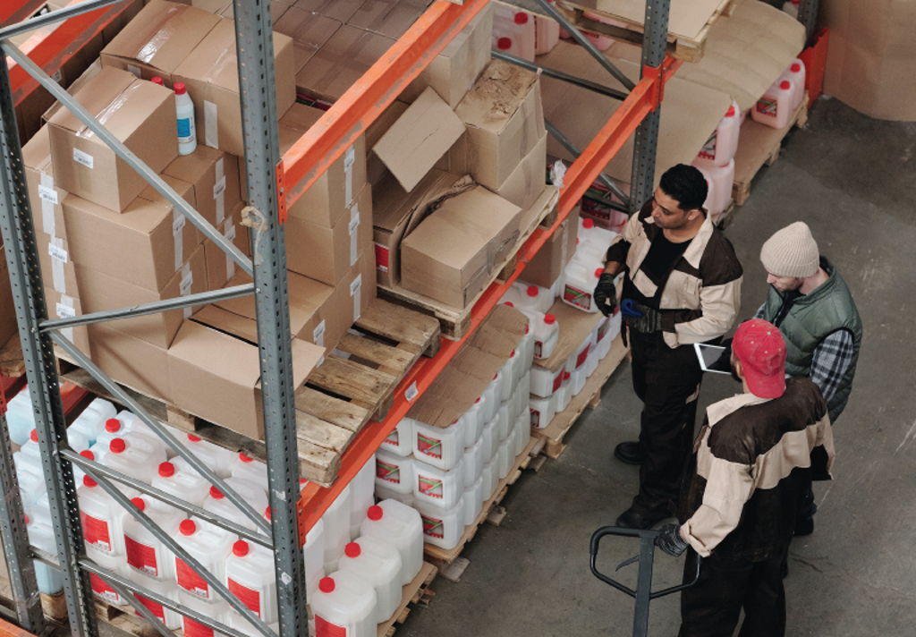 Logistic company employees in a warehouse planning process improvements to increase operational efficiency and reduce costs